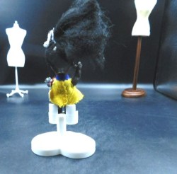 small black doll hp yellow
